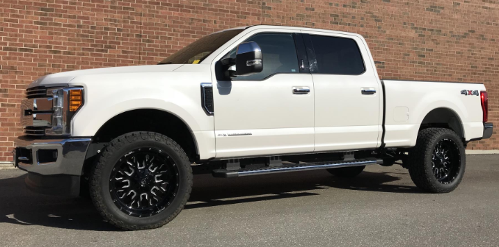 Outdoor photo of a white Ford 6.7 Powerstroke diesel pickup truck