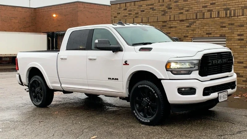 Showing the exterior white body of a 2019 Dodge Ram Cummins pickup truck.